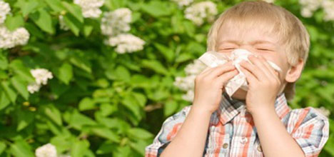 Boy blowing his nose