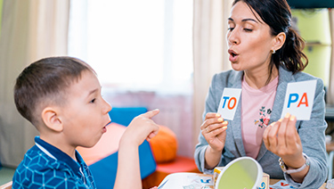 Boy in speech therapy.