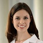 a woman smiling at the camera