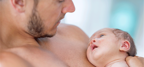Father holds new baby