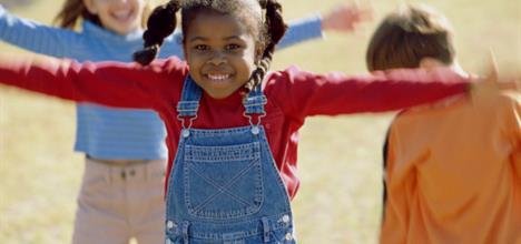 Small children playing outside.