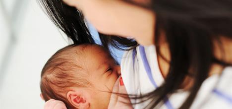 mother breastfeeding infant
