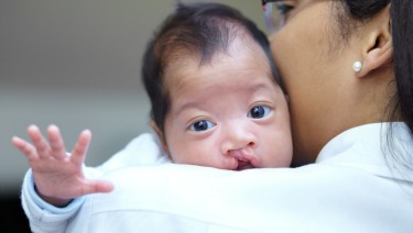 a person holding a baby