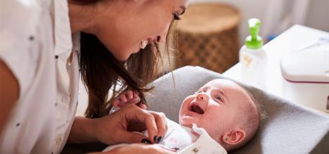 When do babies first smile?