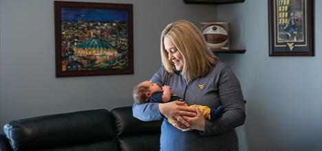 a person holding a baby