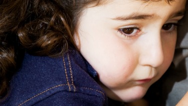 Girl with sad face.