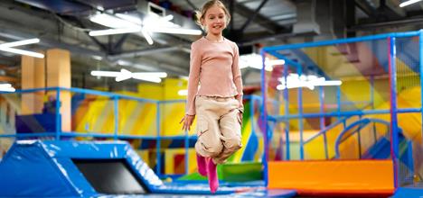 girl jumping on trampoline