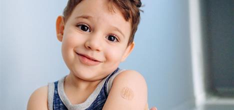 a baby with a tattoo on her arm